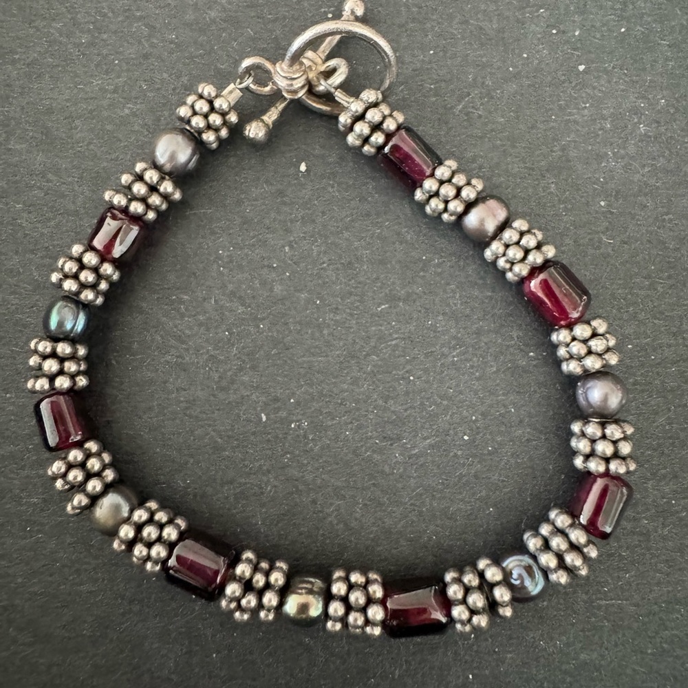 Silver and red bead bracelet with toggle clasp.